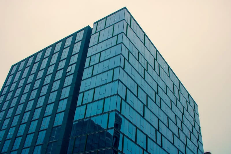 Low angle photography of glass building